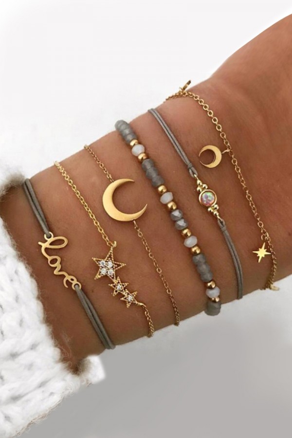 Ensemble de bracelets à décor d'étoiles et de lune en or cendré